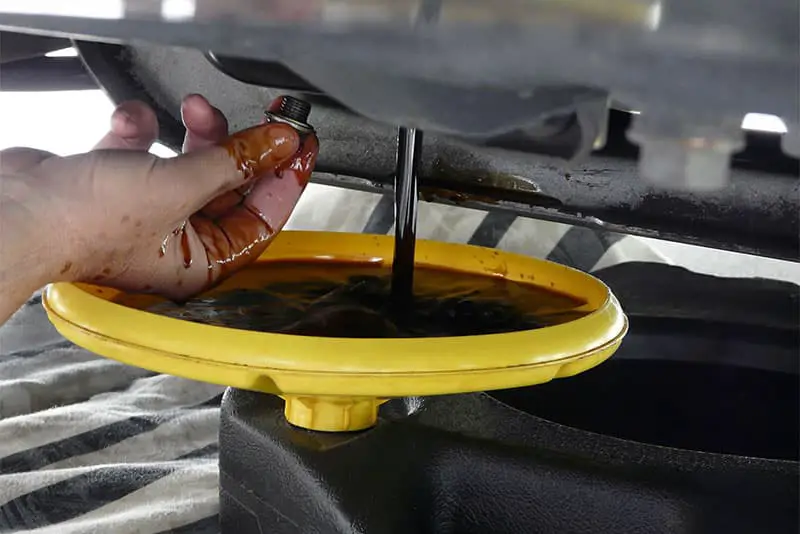 Oil collecting in a pan during an oil change