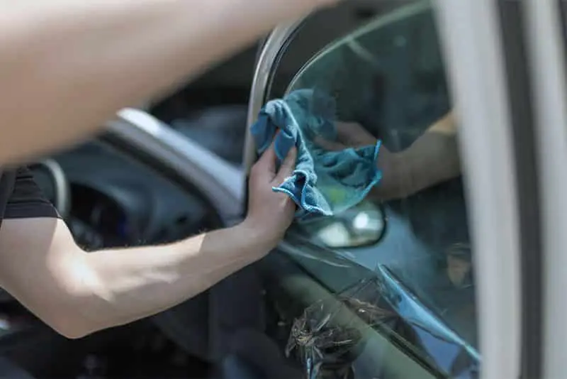 removing window tint glue with a rag